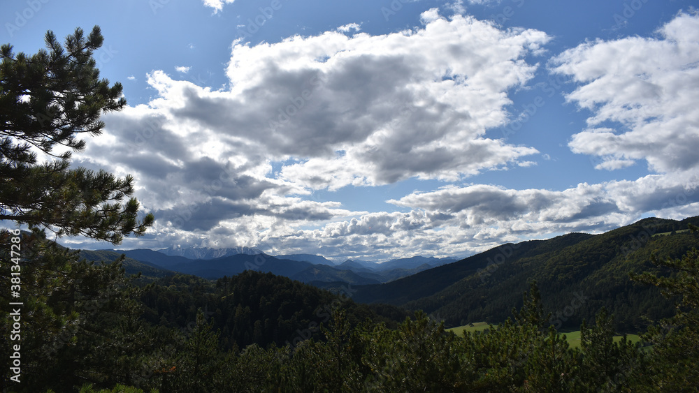 Fototapeta premium Landscape with intense clouds, hills and mountains, light and shadows, Schneebergland