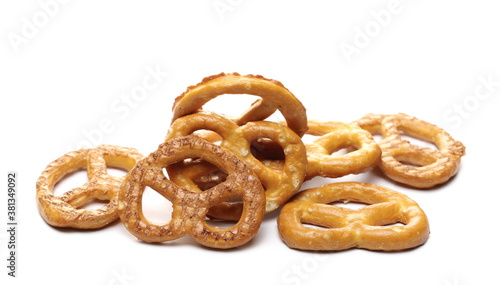 Salty cracker pretzels, party snacks isolated on white background