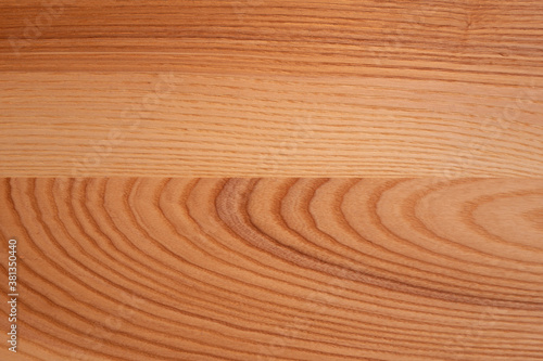 The structure of natural ash wood, tinted oak. Hardwood. Creative vintage background. Imitation of aging.