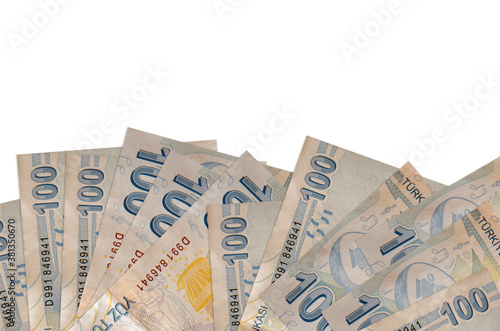 100 Turkish liras bills lies on bottom side of screen isolated on white background with copy space. Background banner template photo