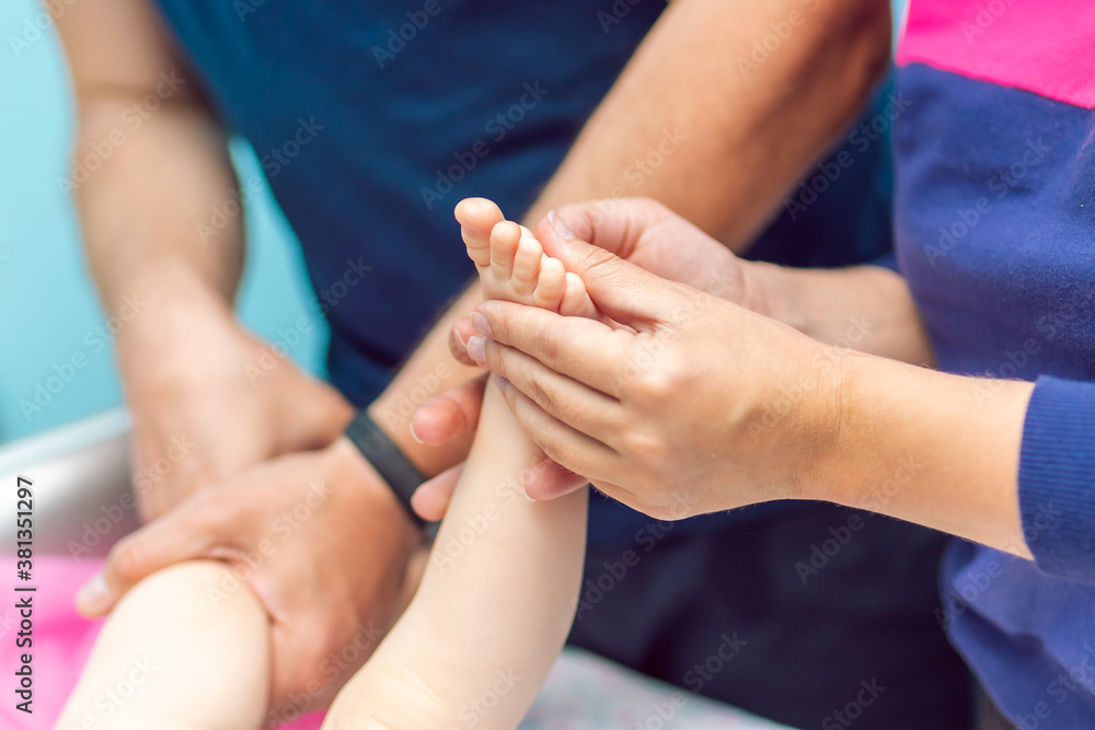 Fototapeta premium Baby massage closeup. Mother and child. Newborn.