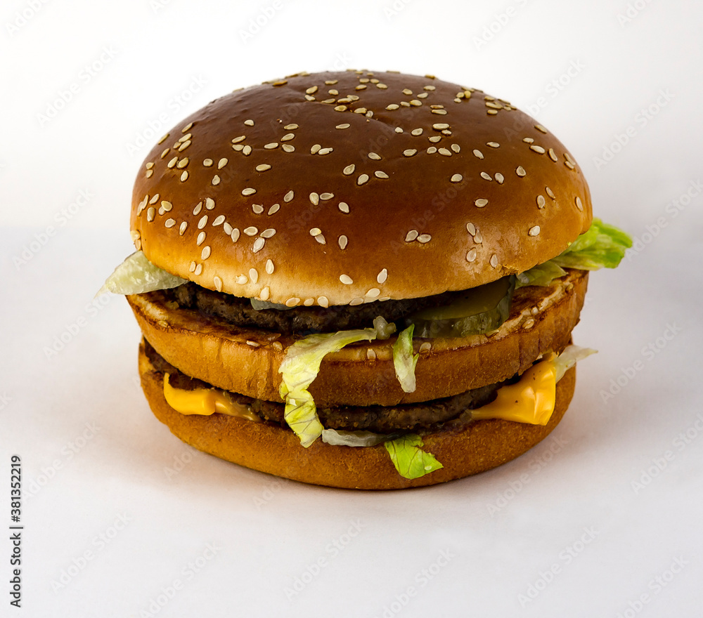 Burger with beef cutlet on a white plate. Burger with beef cutlet on a white plate.