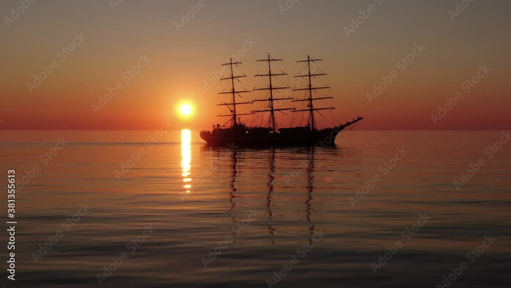Sailing ship in the open ocean. Travel. Freedom. Sunset. Silhouette. Japan sea. Sailing ship in the open ocean. Travel. Freedom. Sunset. Silhouette. Japan sea.