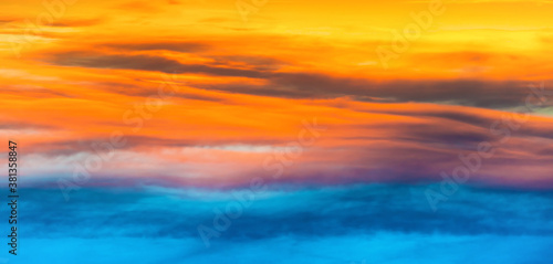 Sunset dramatic sky panorama with colorful clouds as nature sunset background