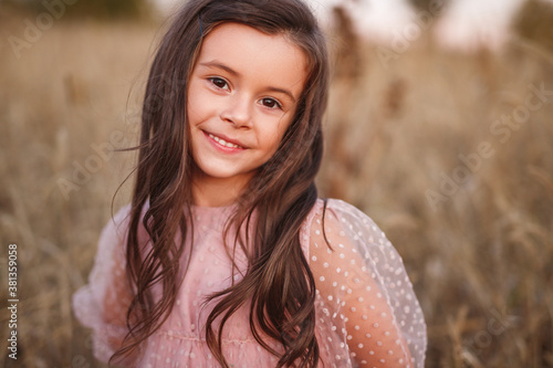 Smiling little girl in field