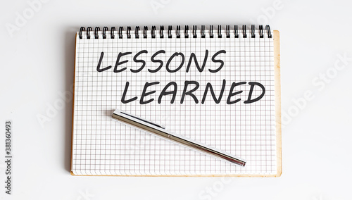 Wallpaper Mural Lessons Learned text written on a notebook with pen Torontodigital.ca