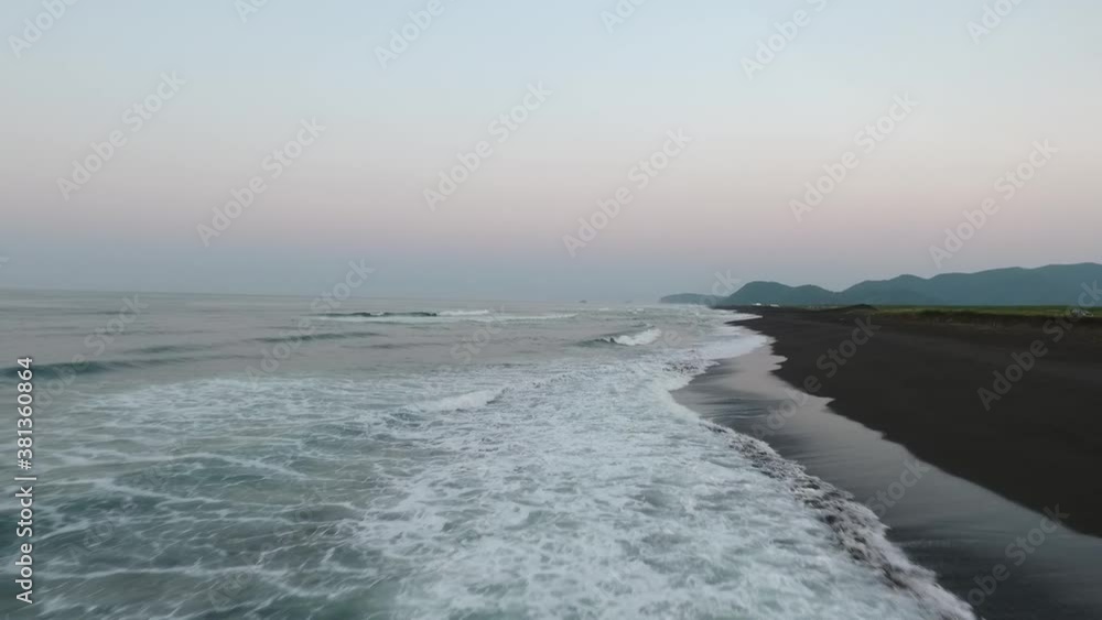 Aerial top dawn view of ocean waves and exotic beach Aerial top dawn view of ocean waves and exotic beach