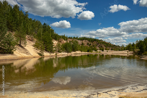 Large quarry for the extraction of clay, inactive, reclaimed. Trees grew on its territory and a lake with clear water and sandy beaches was formed.