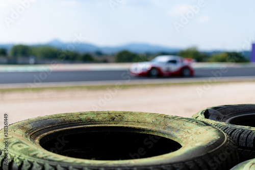 Safety barrier with rubber tires on asphalt motorsport circuit track photo