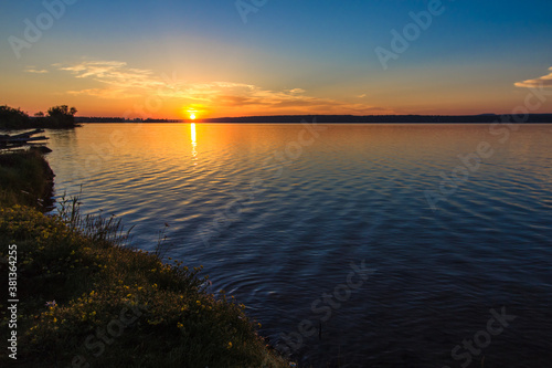 New Day. Sunrise over the calm water of Lake Superior on the Michigan coast. 