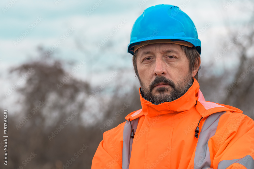 Portrait of confident forestry technician in woodland Portrait of confident forestry technician in woodland