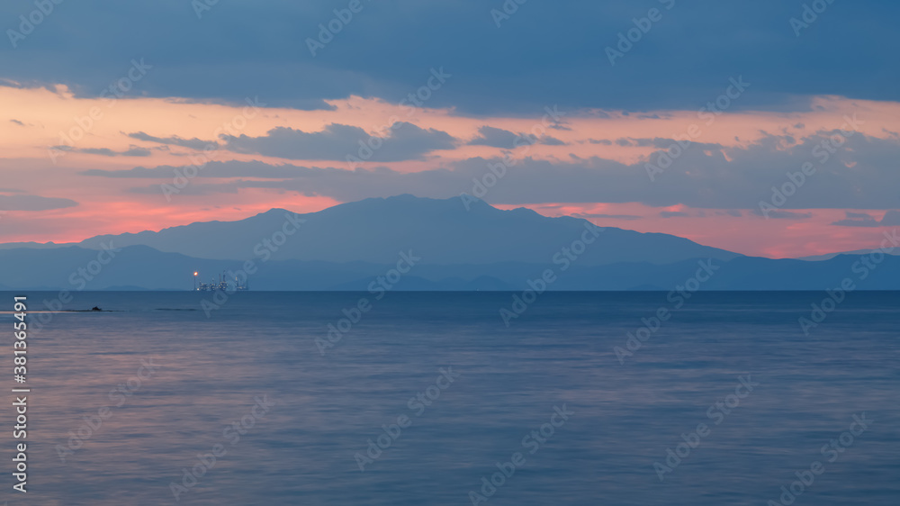 Sea and sky after sunset. Soft blue and pink colors. Calm, tranquility and harmony. Thasos island, Greece.
