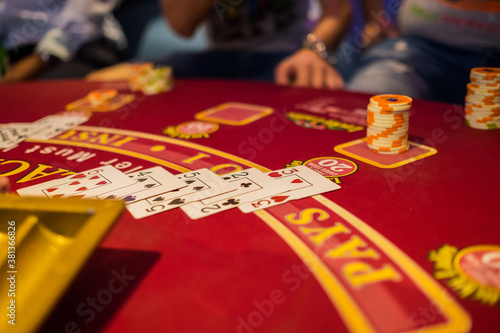 stack of сasino chips on a Black Jack table