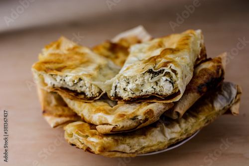 homemade lavash with cottage cheese on wooden table photo