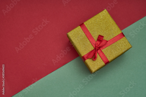 Gifts boxes on green and red paper background. Trendy photo. New year ,christmas concept