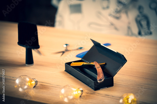 Close up of accessories for barber shop. Scissors, razor, trimmer.