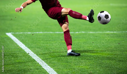 Fototapeta Naklejka Na Ścianę i Meble -  soccer game background player kicking football
