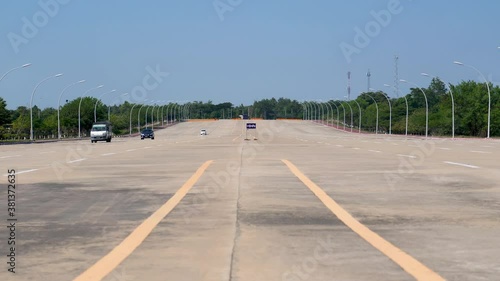 Minimal traffic on the deserted 20 lane highway in the empty new capital Naypyidaw in Myanmar (Burma) photo