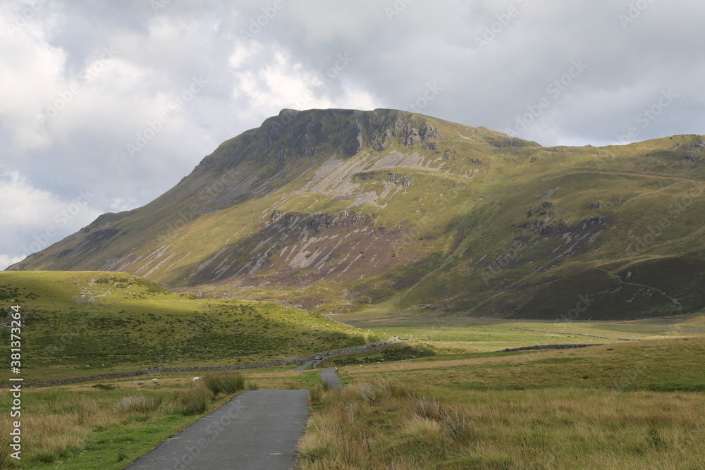 A single lane narrow mountain track up a long, remote valley beside Cadair Idris, Dolgellau, Gwynedd, Wales. A single lane narrow mountain track up a long, remote valley beside Cadair Idris, Dolgellau, Gwynedd, Wales.