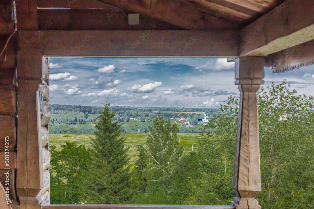 A church built from logs. View of the monastery from the wooden gallery. Eighteenth century architecture. Provincial town of Borovsk in Russia. A church built from logs. View of the monastery from the wooden gallery. Eighteenth century architecture. Provincial town of Borovsk in Russia.