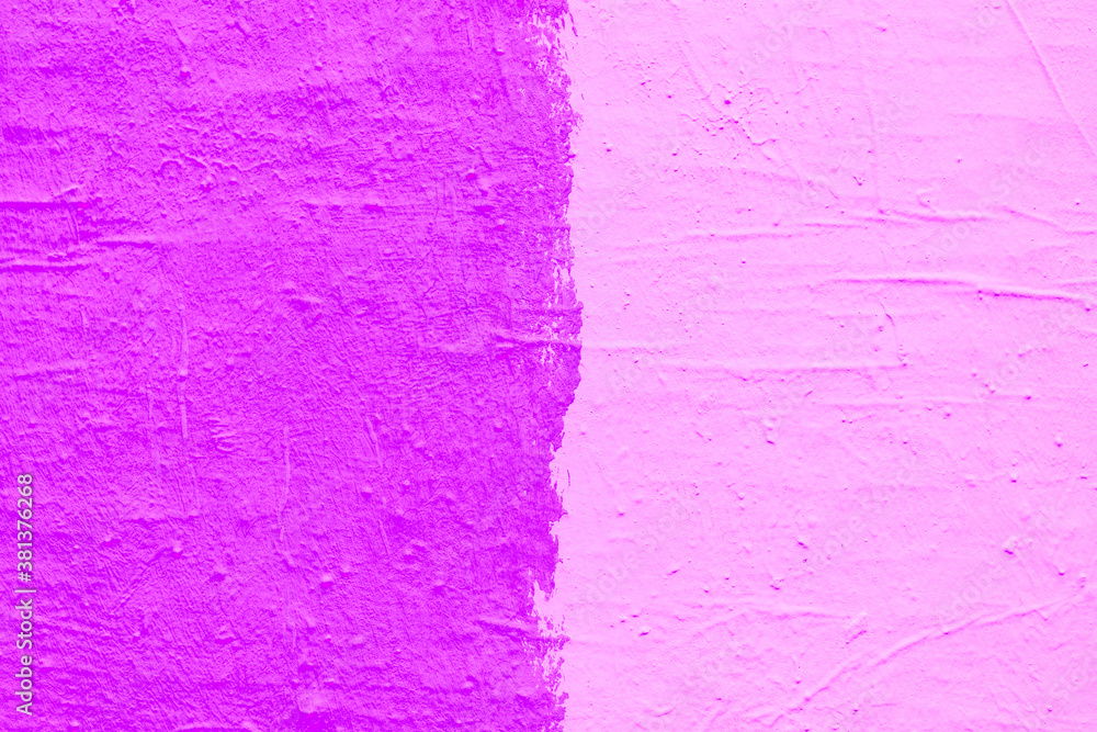 Pink paint texture. Interior of a modern loft. Abstract bright background. The facade of an old house. Divided in half.