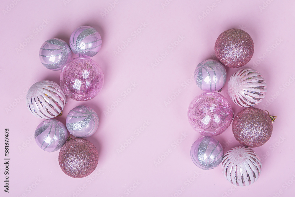 Christmas composition. Set of christmas pink decorations, shiny balls on pastel background. Mock up for new year gretting card. Copy space for text or lettering Christmas composition. Set of christmas pink decorations, shiny balls on pastel background. Mock up for new year gretting card. Copy space for text or lettering