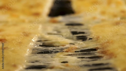 Stretching melted cheese on a mouth-watering pizza.