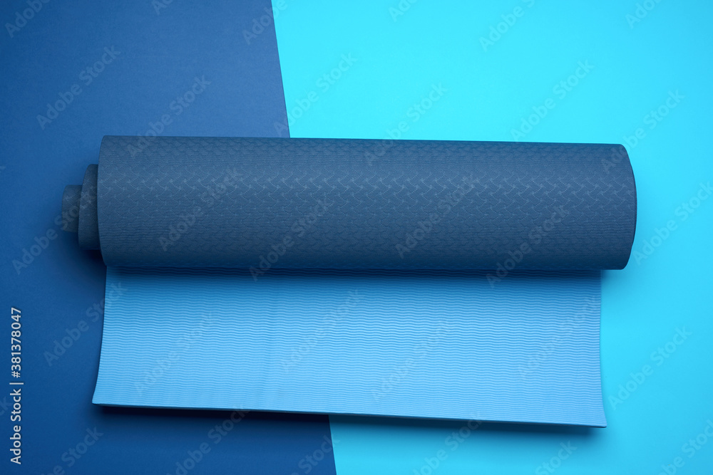 Obraz premium neoprene blue twisted mat lies on a blue background