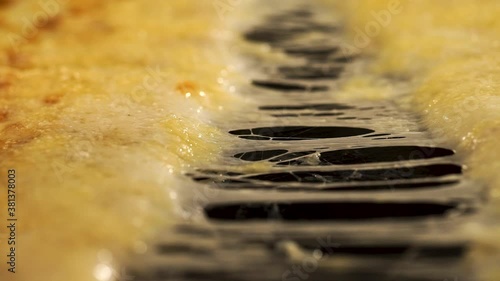 Stretching melted cheese on a mouth-watering pizza.