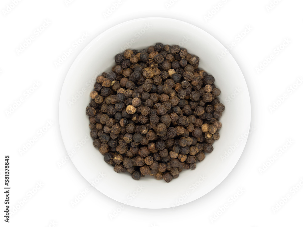 Black pepper, herbs, spices in a white bowl in top view. Black pepper, herbs, spices in a white bowl in top view.