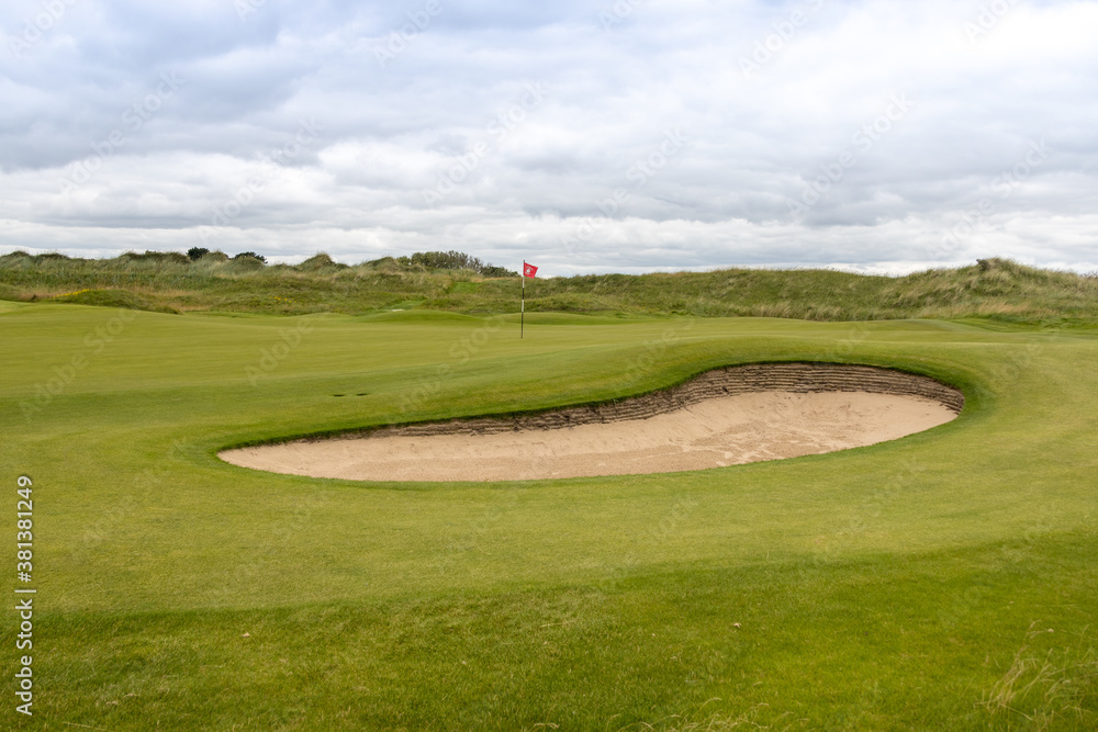 Obraz premium golf course with hole and bunker