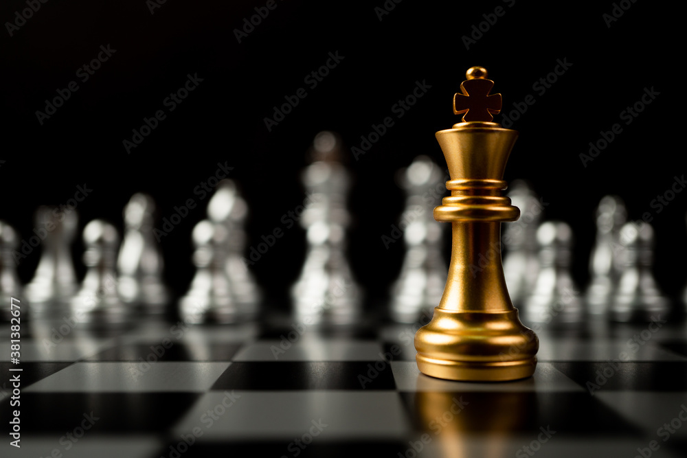 Golden King chess standing in front of other chess, Concept of a leader must have courage and challenge in the competition, leadership and business vision for a win in business games Golden King chess standing in front of other chess, Concept of a leader must have courage and challenge in the competition, leadership and business vision for a win in business games