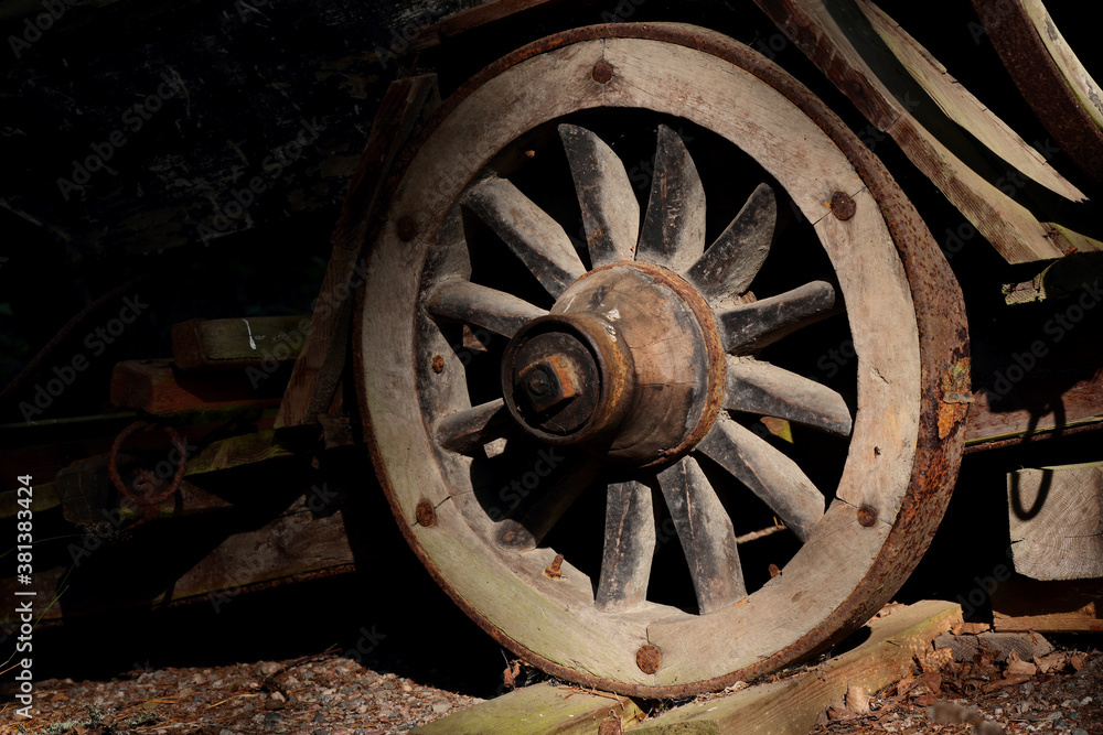 An old abandoned wheel in evening light