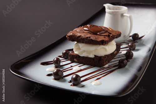 Brownie cake with ice cream and chocolate sauce