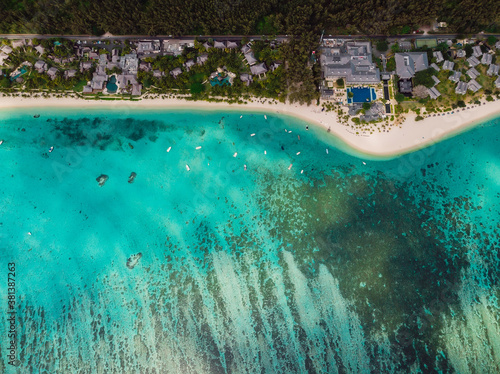 Luxury beach with resorts, palms and ocean in Mauritius. Aerial view