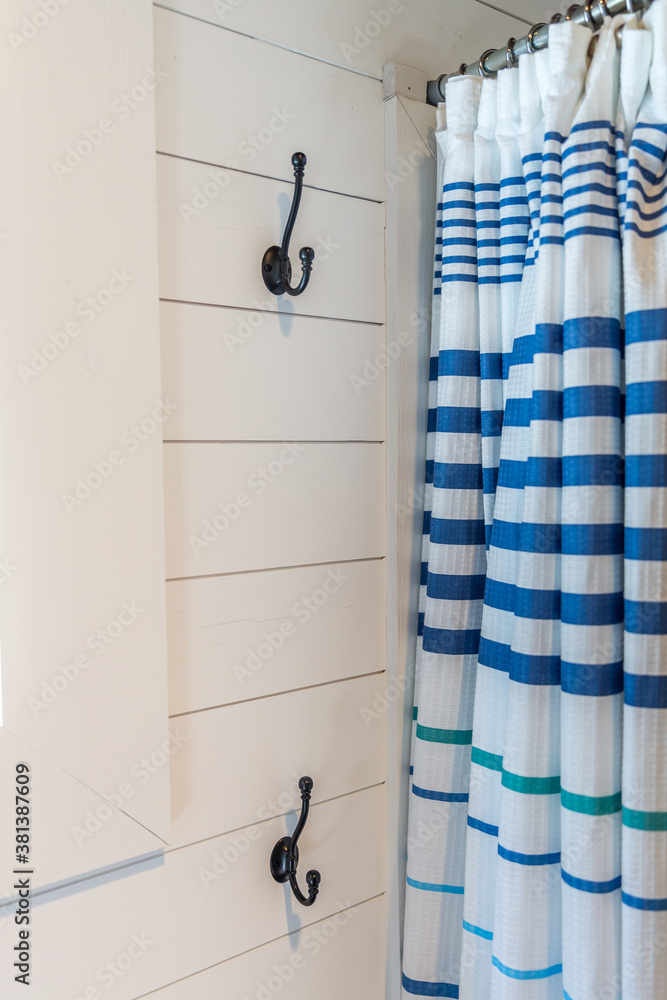 Small and compact bathroom shower stall in a small farmhouse decor