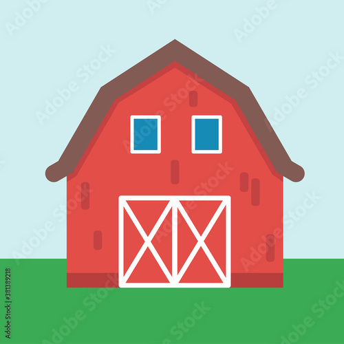 Red barn (front view) with the background of green field and blue sky