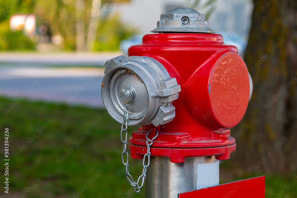 Red metal fire hydrant on the side of the street Red metal fire hydrant on the side of the street
