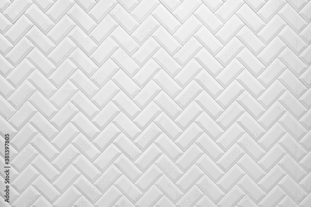 White tile on the wall in the bathroom. White tile on the wall in the bathroom.