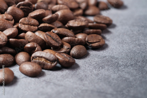 fresh coffee beans on black background with copy space.
