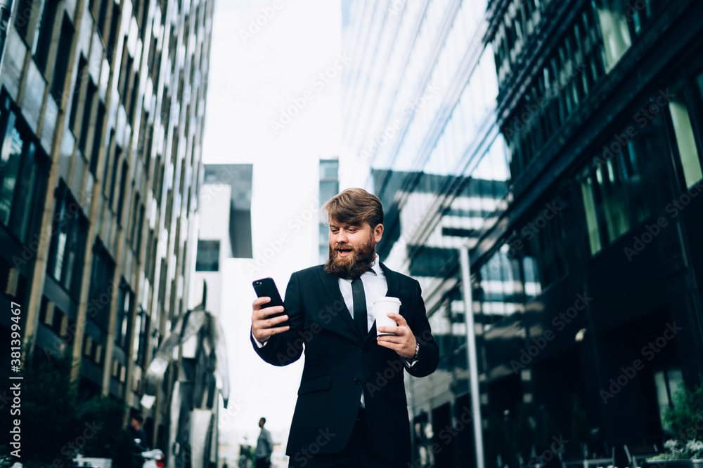 Confident businessman using smartphone on city street Confident businessman using smartphone on city street