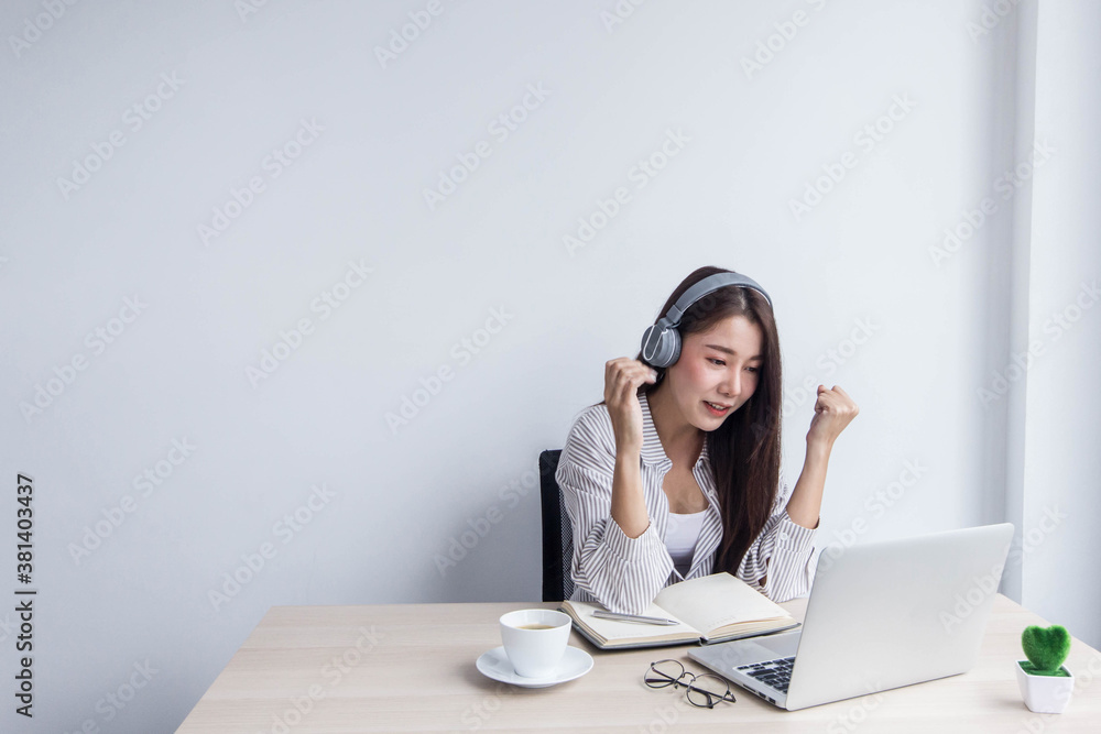 Close-up photo of business woman wearing glasses And she is using the laptop. Close-up photo of business woman wearing glasses And she is using the laptop.