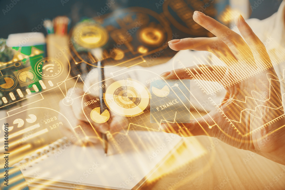 Fototapeta premium Tech theme hologram over woman's hands taking notes background. Concept of hightech. Double exposure