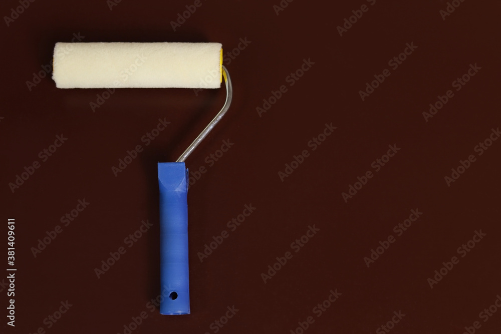 Obraz premium paint roller dark brown background