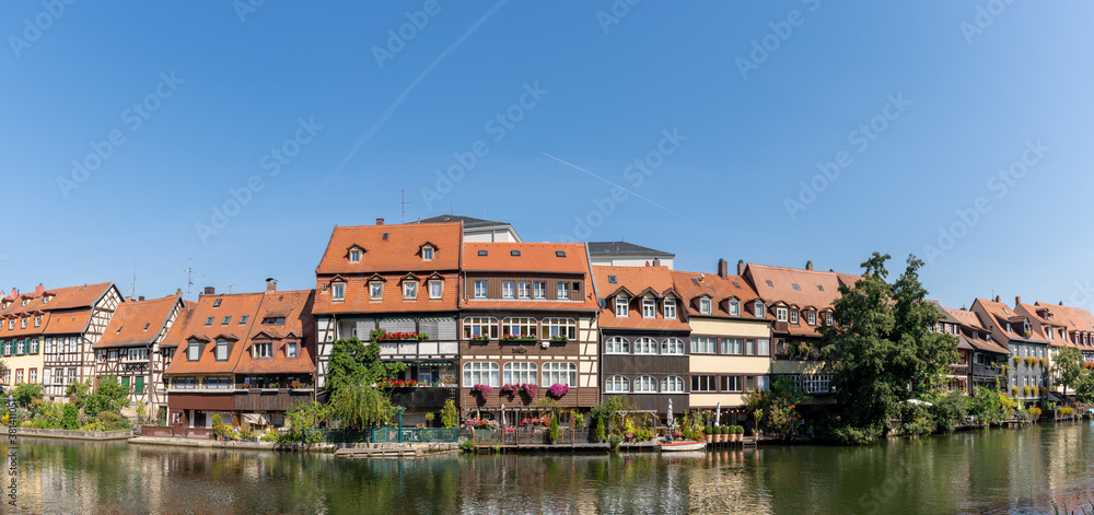 historic and colorful half-timbered houses on the banks of the Regnitz river in Bamberg in Bavaria