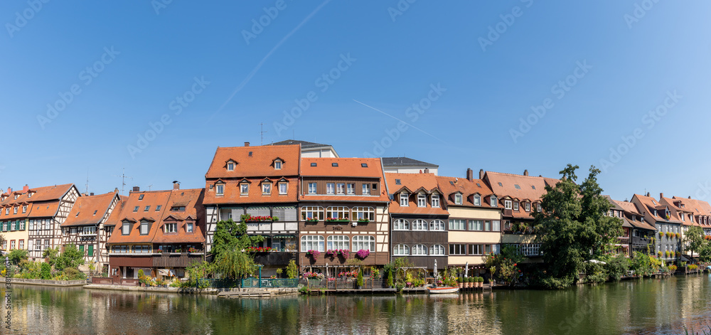 Obraz premium historic and colorful half-timbered houses on the banks of the Regnitz river in Bamberg in Bavaria