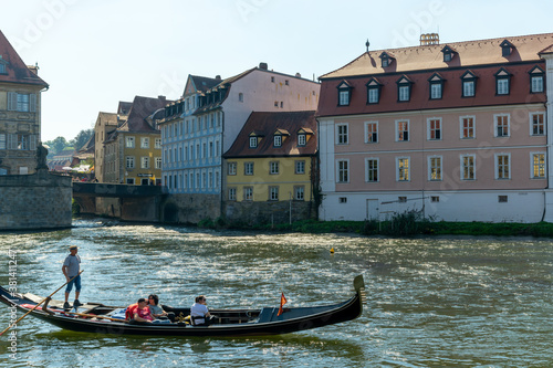 the Regnitz river in Bamberg with a gondola on a ruise