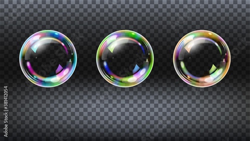 Colorful realistic soap bubbles. Set of realistic vector transparent colorful soap bubbles with rainbow reflection isolated on checkered background.