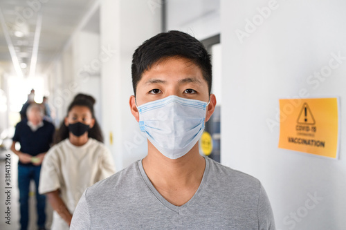 Portrait of people with face masks waiting, coronavirus, covid-19 and vaccination concept.