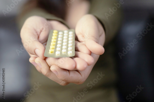 Women carry birth control pills The concept of sex education.